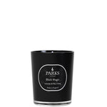 A black candle with a white label that reads 'PARKS Black Magic Lavender & May Chang 180g'.
