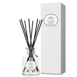 A clear glass diffuser bottle with black reeds and a white label, alongside a matching white box, both featuring the text 'PARKS' and 'Fine Fragrance'.