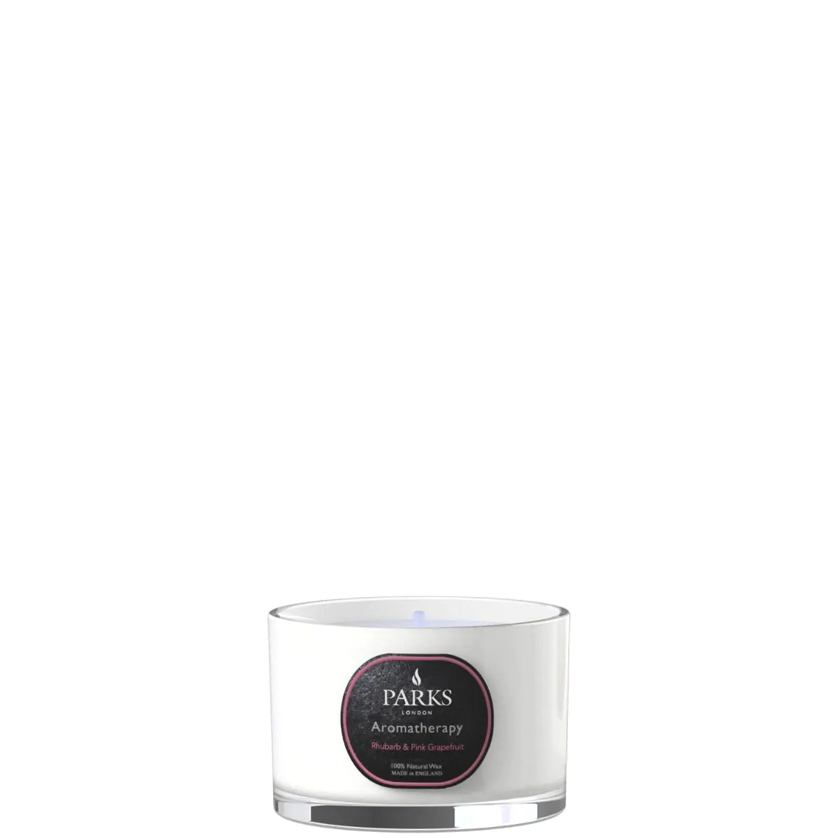 A white cylindrical glass candle with a label that reads 'PARKS', 'Rhubarb & Pink Grapefruit' and has a small floral design.