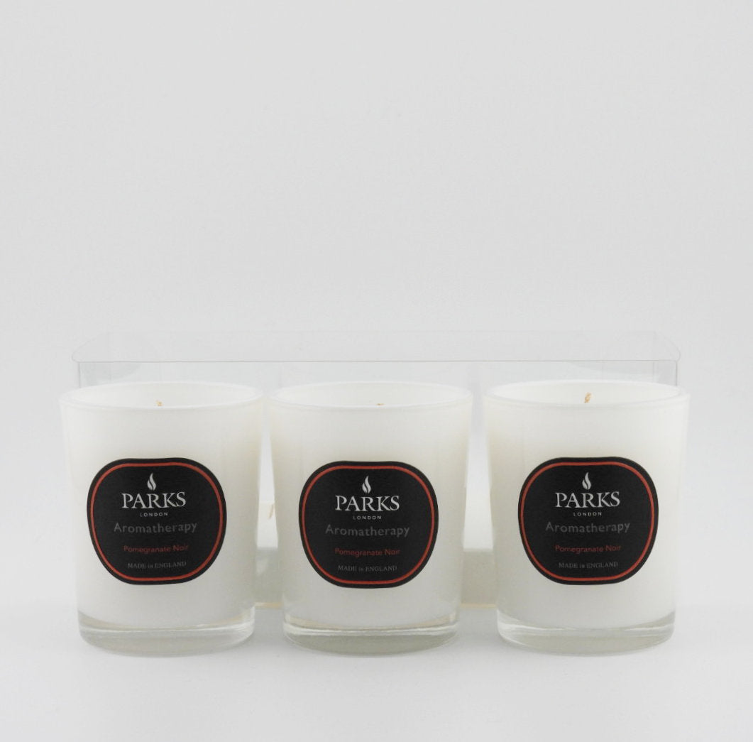 Three candles with 'Parks' labels on a white background