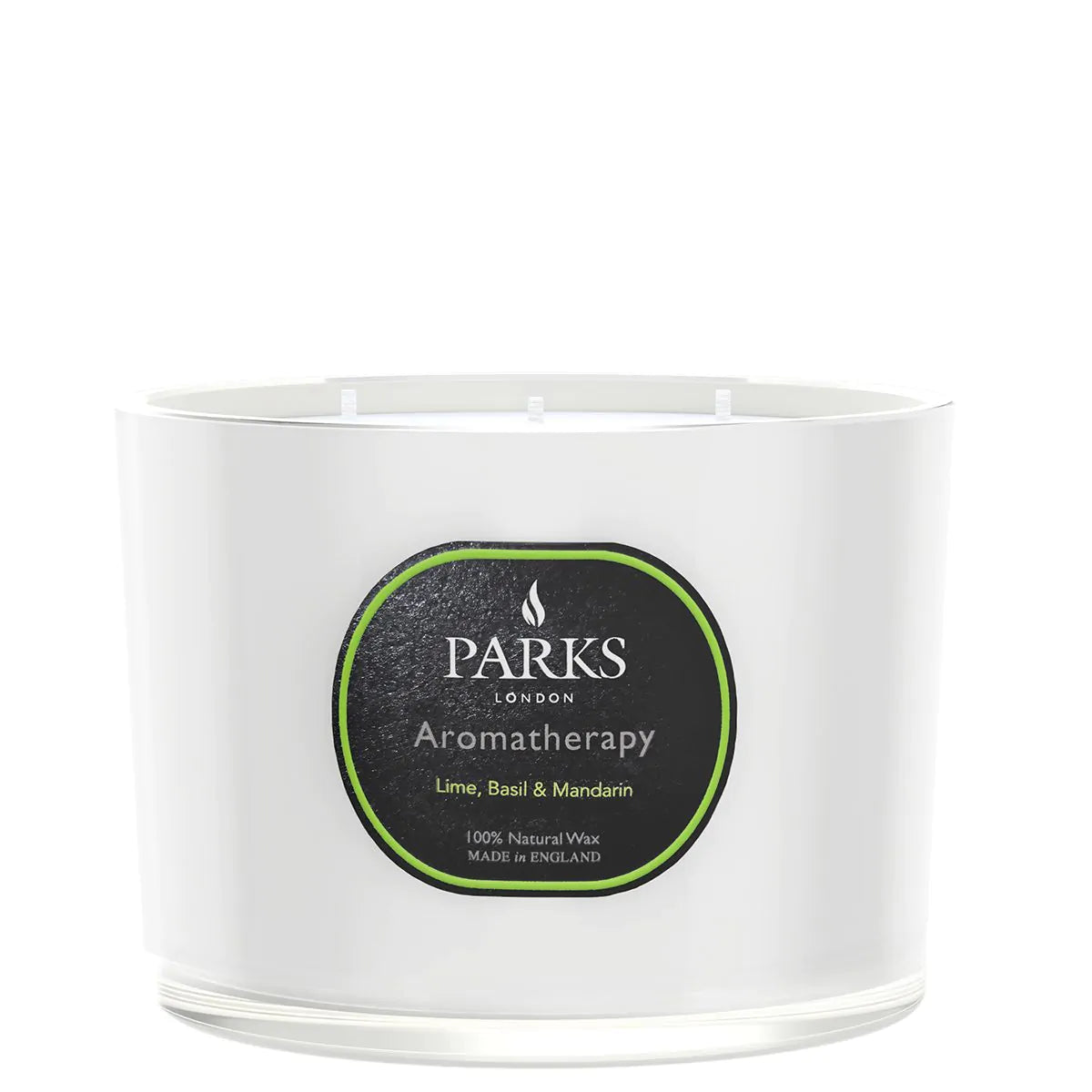 A white, 3-wick candle with a label that reads 'PARKS Aromatherapy, Lime, Basil & Mandarin', indicating the fragrance.