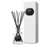 Parks Aromatherapy diffuser with black sticks and white packaging on a white background