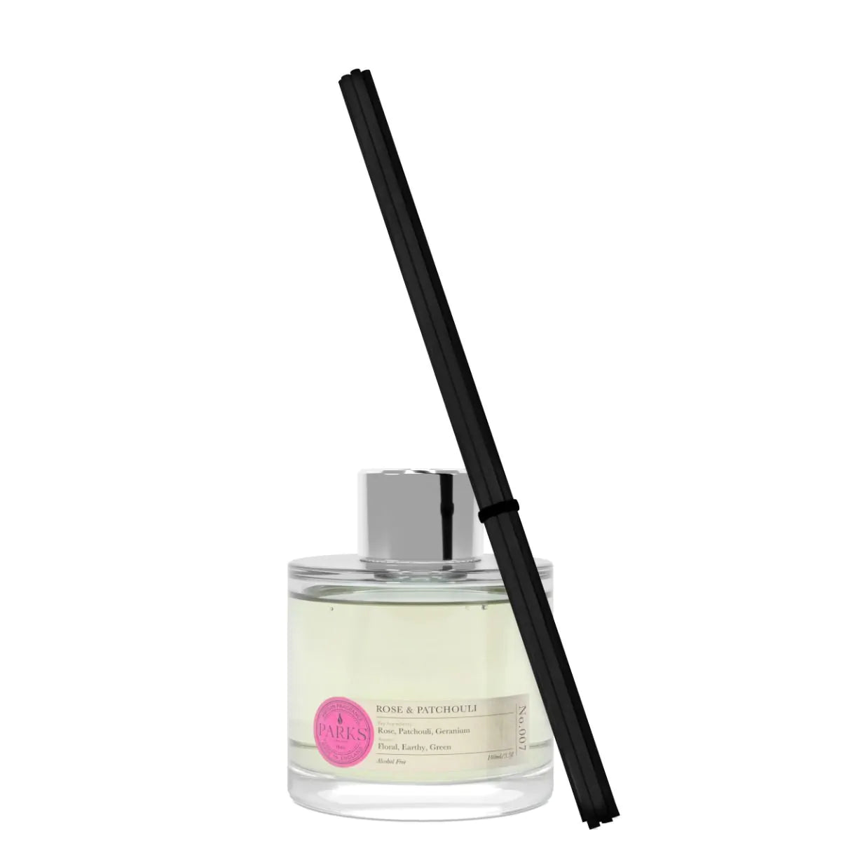A clear glass diffuser bottle with a pink label and a black reed stick, containing a yellow liquid.